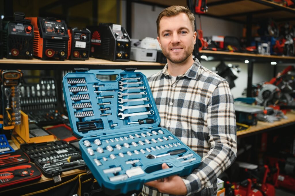 a male buyer chooses a toolbox in a hardware store. a large selection of tools.